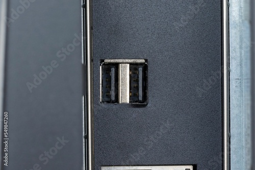 Canvas Print Closeup shot of firewire and small inputs on a digital computer workstation