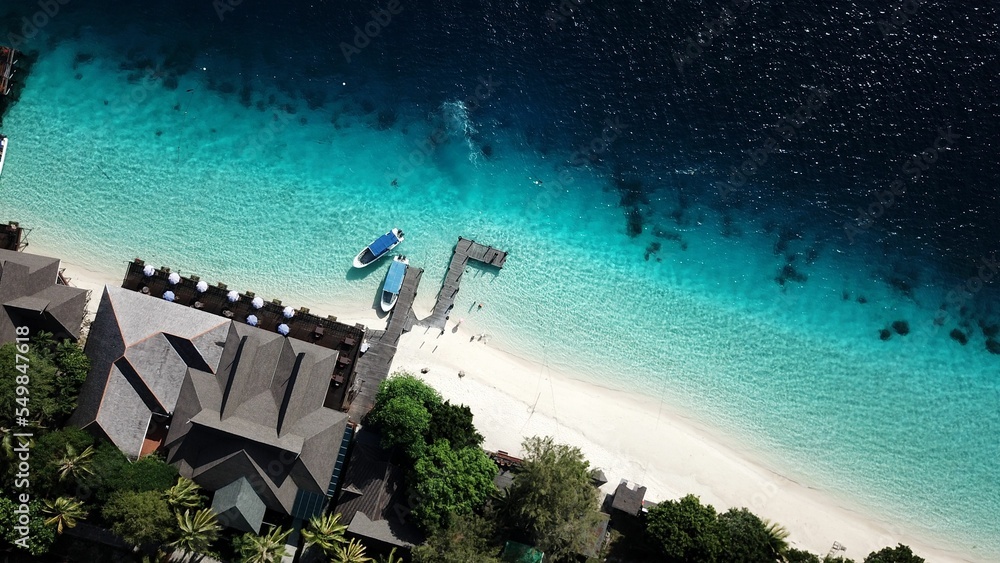 Fototapeta premium View of stunning Mataking island coastline with sandy beach seen from the air, Malaysia