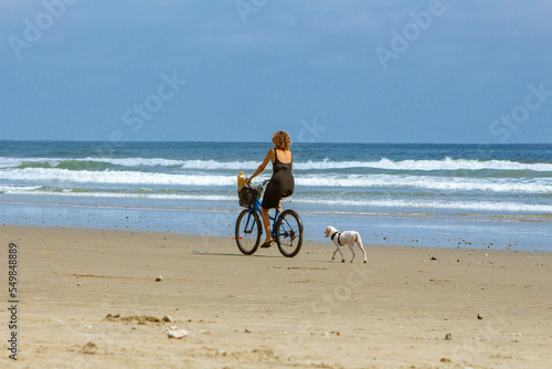 woman on the beach in bike