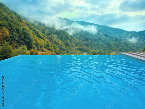 Outdoor swimming pool at luxury resort with beautiful view of mountains