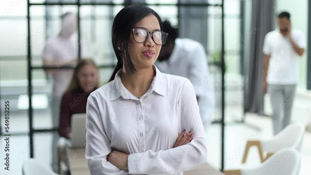 asian business woman with glasses looking away asian business woman with glasses looking away