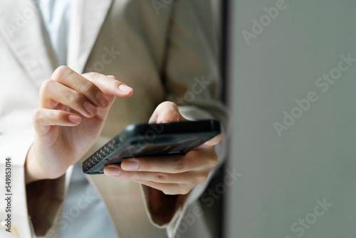 Close up of Businesswoman working at office using telephone.