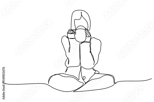 Hygge life style. Continuous one line drawing of a girl or woman. Drawing design Concept for Mood of coziness and comfortable conviviality with feeling of wellness and contentment.