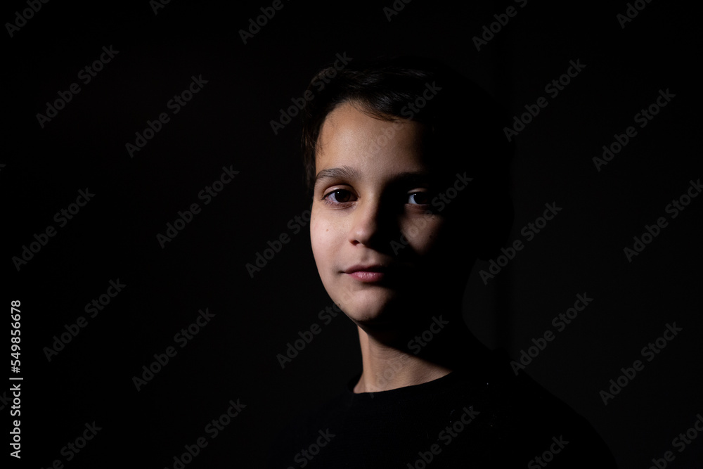 Low Key Portrait Of Boy In Rembrandt Lighting Low Key Portrait Of Boy In Rembrandt Lighting