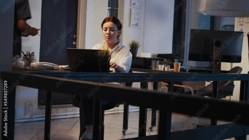 Disruptive female CEO working on laptop to plan report and send professional email late at night, creating corporate presentation. Using computer to do executive sharing on network app. Disruptive female CEO working on laptop to plan report and send professional email late at night, creating corporate presentation. Using computer to do executive sharing on network app.