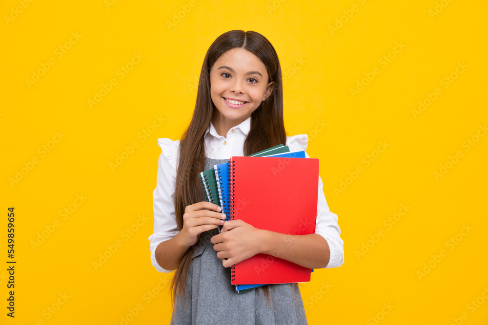 Teenager school girl study with books. Learning knowledge and kids education concept. Happy schoolgirl face, positive and smiling emotions. Teenager school girl study with books. Learning knowledge and kids education concept. Happy schoolgirl face, positive and smiling emotions.