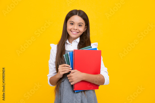 Teenager school girl study with books. Learning knowledge and kids education concept. Happy schoolgirl face, positive and smiling emotions.
