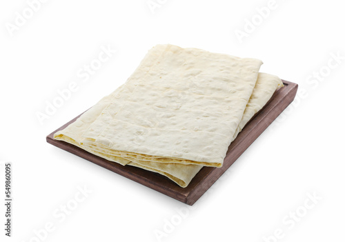 Wooden tray with delicious Armenian lavash on white background