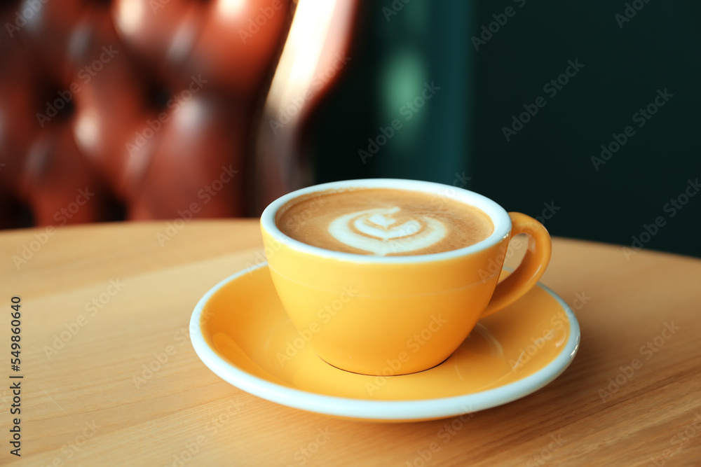 Cup of delicious coffee on wooden table indoors Cup of delicious coffee on wooden table indoors