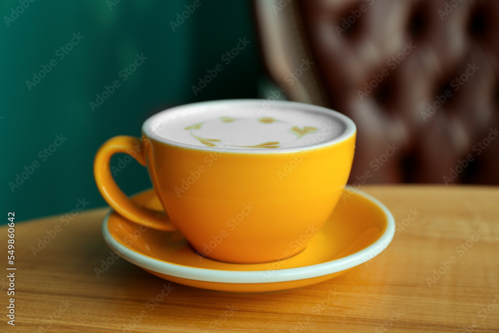 Cup of delicious coffee on wooden table indoors, closeup Cup of delicious coffee on wooden table indoors, closeup