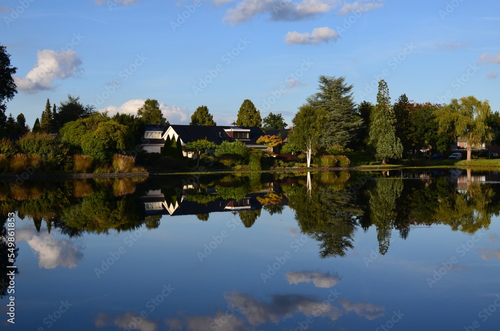 Fototapeta premium Picturesque view of pond and beautiful estate