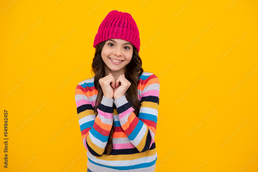 School girl in winter clothes and warm hat. Winter holiday vacation. Child fashion model. Happy teenager, positive and smiling emotions of teen girl. School girl in winter clothes and warm hat. Winter holiday vacation. Child fashion model. Happy teenager, positive and smiling emotions of teen girl.