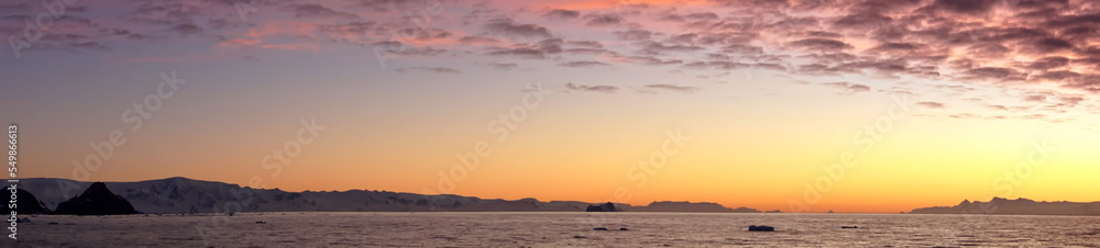 Popcorn clouds illuminated pink over the silhouette of a mountain, at sunset at Cierva Cove, Antarctica Popcorn clouds illuminated pink over the silhouette of a mountain, at sunset at Cierva Cove, Antarctica