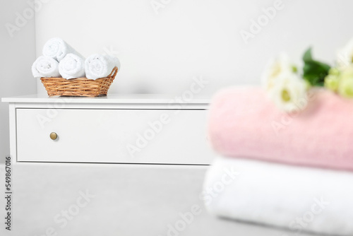 Different folded soft terry towels in room