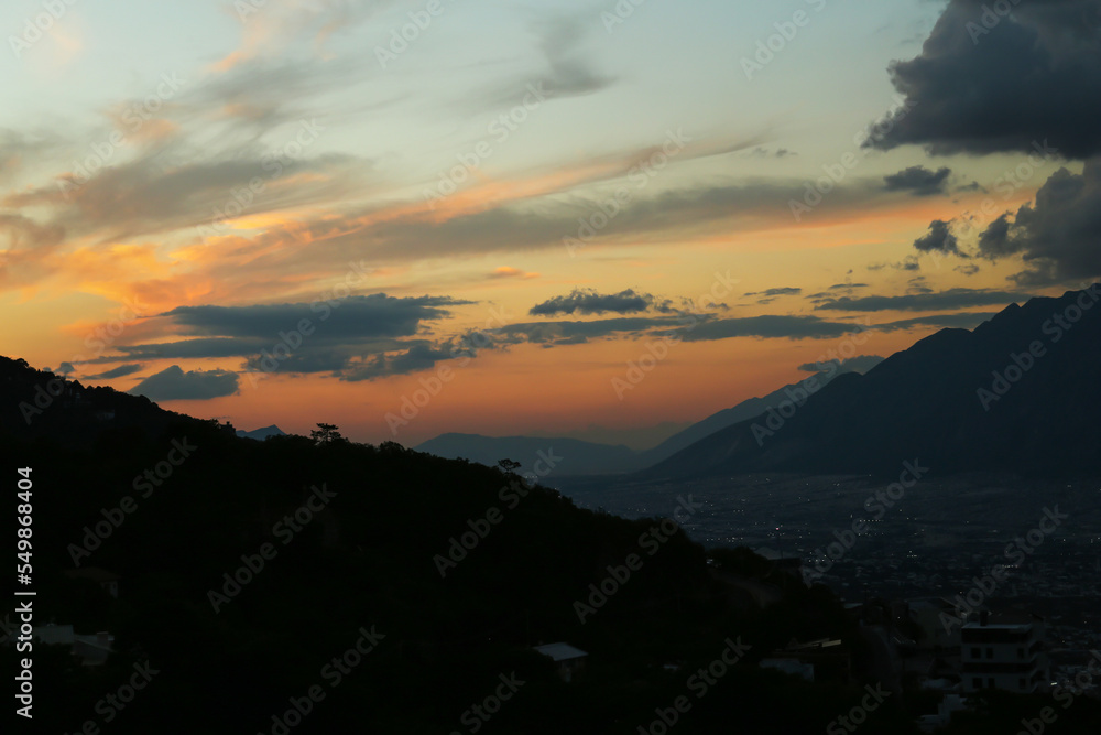Obraz premium Picturesque view of big mountains under clouds in evening