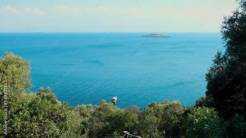 Trees On The Island Near The Beautiful Sea 4k. Tropical island at sunny day arial view, nature background with copy space. Trees On The Island Near The Beautiful Sea 4k. Tropical island at sunny day arial view, nature background with copy space.