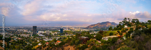 Universal City Skyline Sunset Cityscape over Mulholland Scenic Drive in Hollywood, Los Angeles, California, dramatic cloudscape, smog, and hills