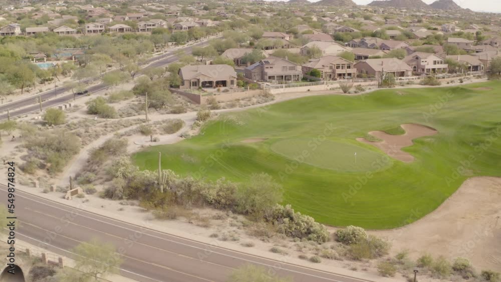A aerial view of a golf course in the southwestern United States during the winter season. A aerial view of a golf course in the southwestern United States during the winter season.