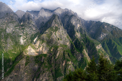 Jade Dragon Snow Mountain captured on a cloudy summer morning from Tiger Leaping Gorge hiking trail. Beautiful light