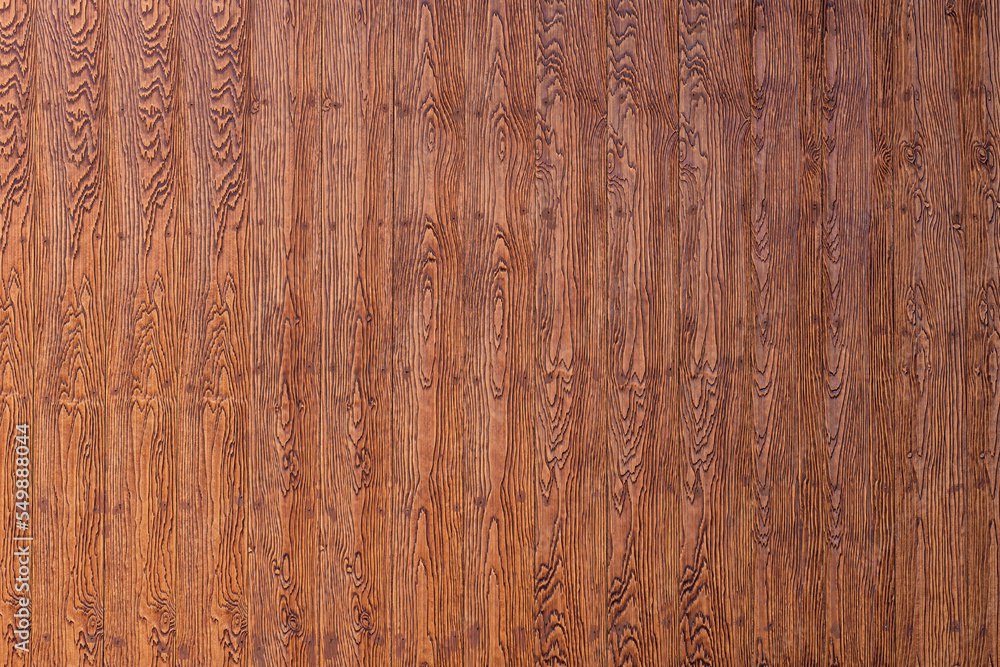 Fototapeta premium Brown shera wood panels are patterned like real wood used in the construction of houses. Beautiful brown shera wood wall texture use for background. Fake woods plank texture background with copy space
