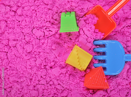 pink sand with sand toys