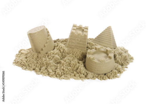 Sand Castles of kinetic sand and toys isolated on white background.