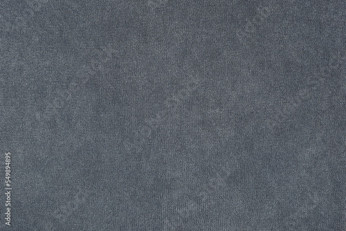 Texture of gray knitted fabric. Grey cloth background. Knitted pattern