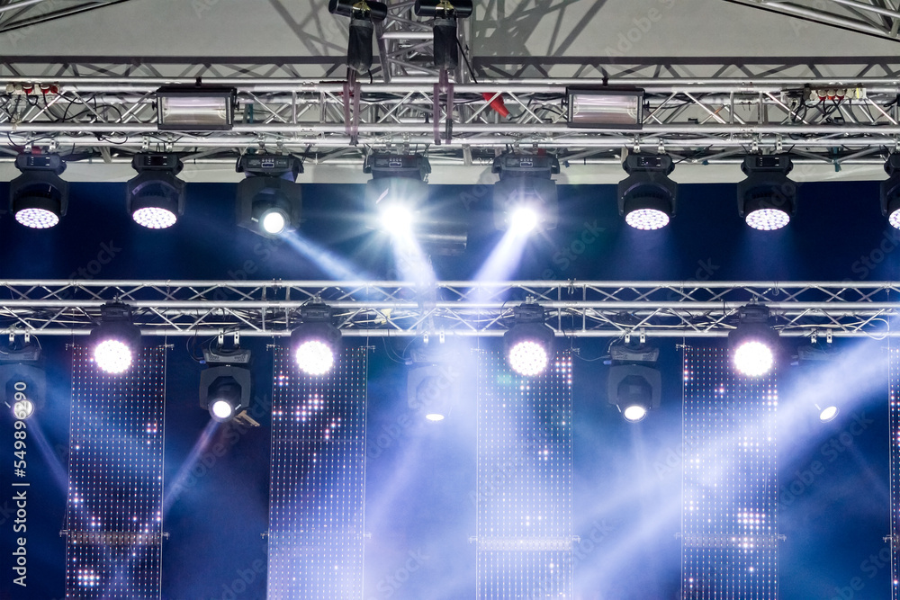 stage lighting equipment. spotlights on outdoor concert stage with