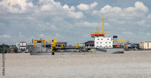 The vessel - a trailing suction hopper dredger at entrance the Chao Phraya River photo