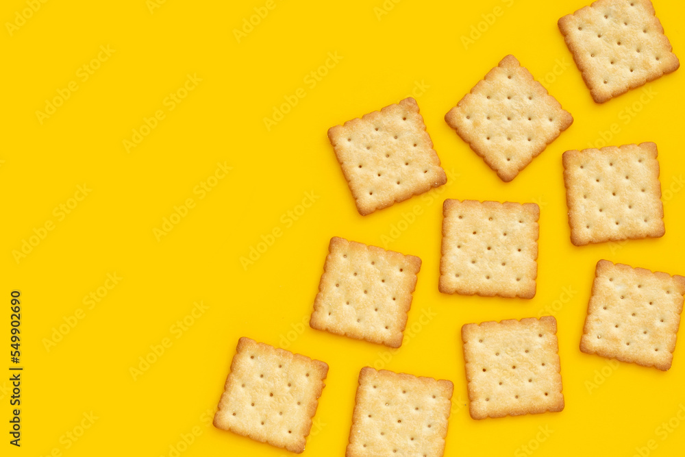 Dry cracker cookies on yellow background. Dry cracker cookies on yellow background.