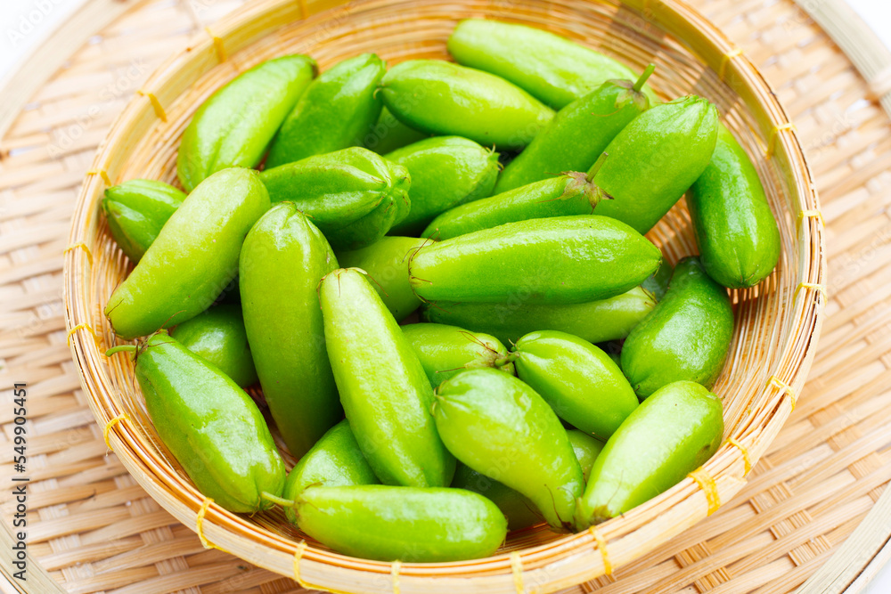 Bilimbi fruit in bamboo basket on white background. Bilimbi fruit in bamboo basket on white background.