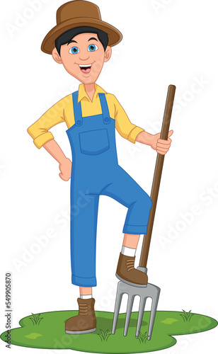 happy boy farmer holding a rake