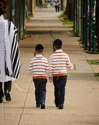 Hasidic jewish boys walking down the street in williamsburg brooklyn. 