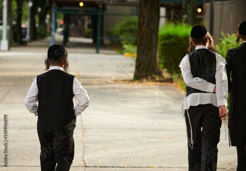 Hasidic jewish boys walking down the street in williamsburg brooklyn. 