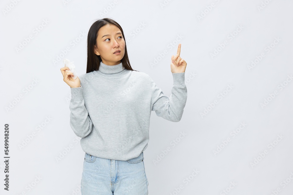 Asian woman holding hand with handkerchief and coughing up flu and cold, stuffy nose viral disease asthma and allergies covid, white background Asian woman holding hand with handkerchief and coughing up flu and cold, stuffy nose viral disease asthma and allergies covid, white background