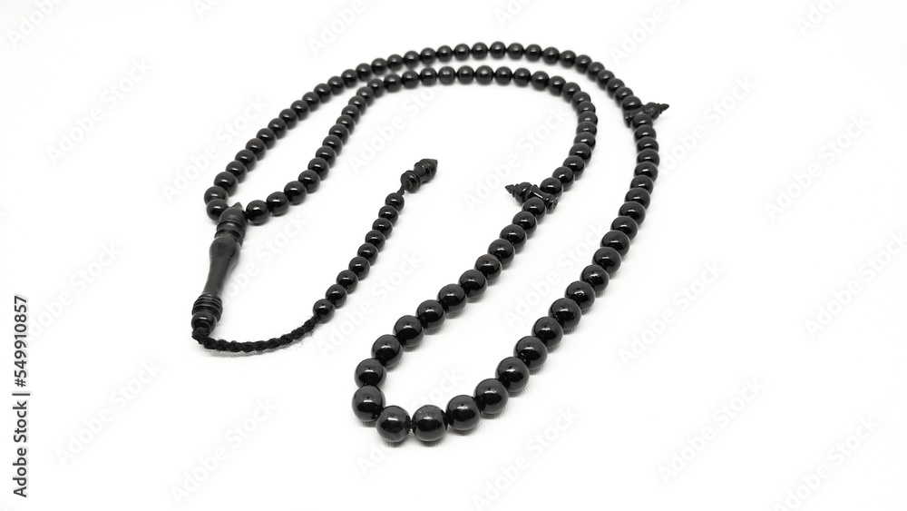 Mate black onyx prayer beads tasbih on a white background Mate black onyx prayer beads tasbih on a white background