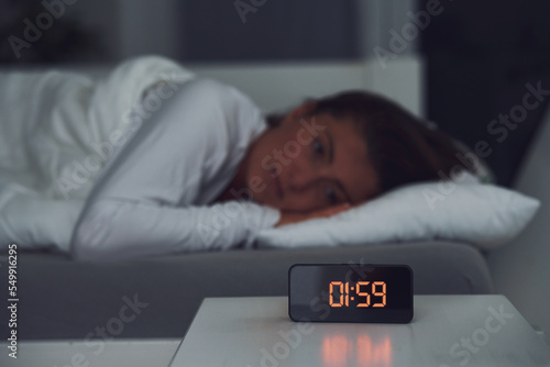 Young woman in the bed with sleep problems