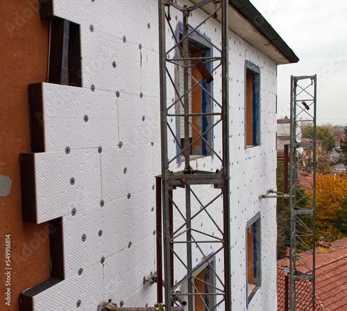 Building site for construction of external thermal insulation. Energy saving concept. Bologna, Italy photo