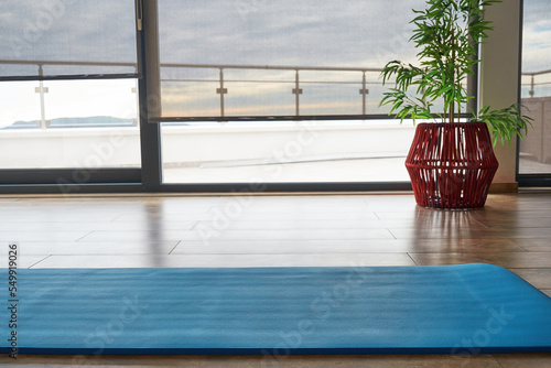 Cozy room for fitness close to the sea with exercise mat. Empty place for aerobic and stretching