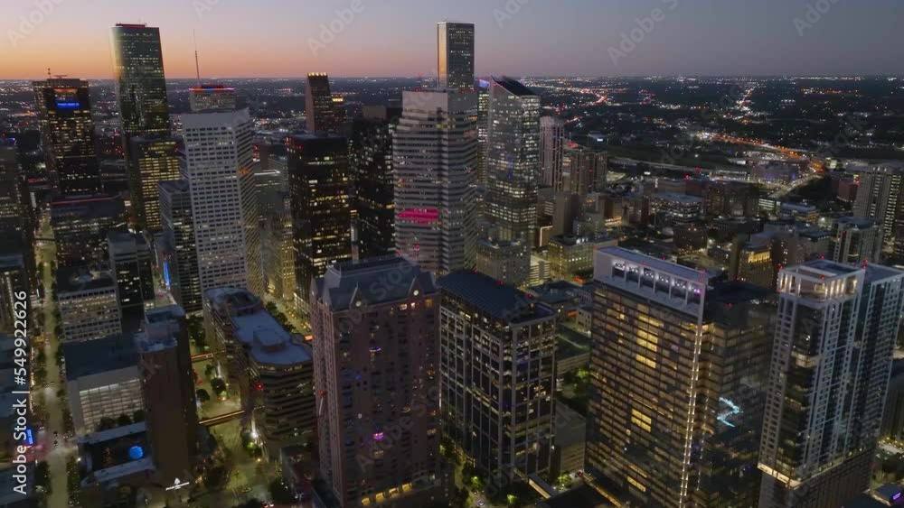Aerial view around skyscrapers on the east side of the illuminated Houston city, USA - circling, drone shot Aerial view around skyscrapers on the east side of the illuminated Houston city, USA - circling, drone shot