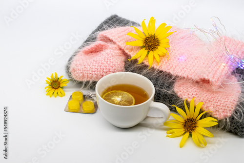 herbal healthy drinks hot honey lemon and lozenge for health care sore throat with flowers sunflower arrangement flat lay style on background white