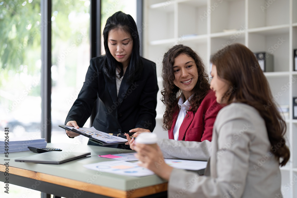 Fototapeta premium business adviser meeting to analyze and discuss the situation on the financial report in the meeting room.Investment Consultant, Financial advisor and accounting concept