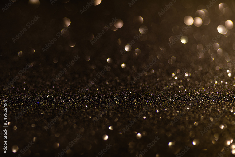 Black glittering background for design and free space.