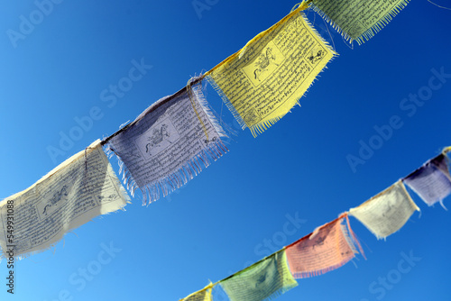 Tableau sur toile Tibetan flags moving with the wind, spreading prayers and good intentions