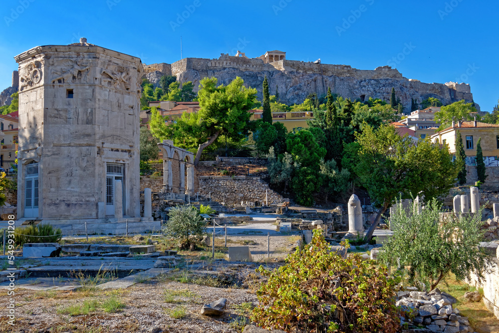 The Wind's Tower in the Roman forum, under Acropolis hill and the crystal clear blue sky. A beautiful day in Athens, Greece.