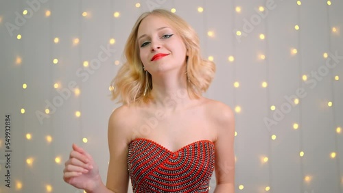 beautiful girl dancing in red dress.