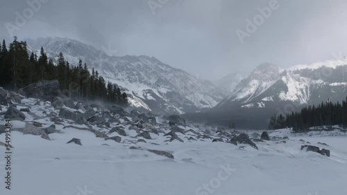 Wallpaper Mural Beautiful snowstorm sweeps rocks over the frozen lake in Canadian Rocky Mountains Torontodigital.ca