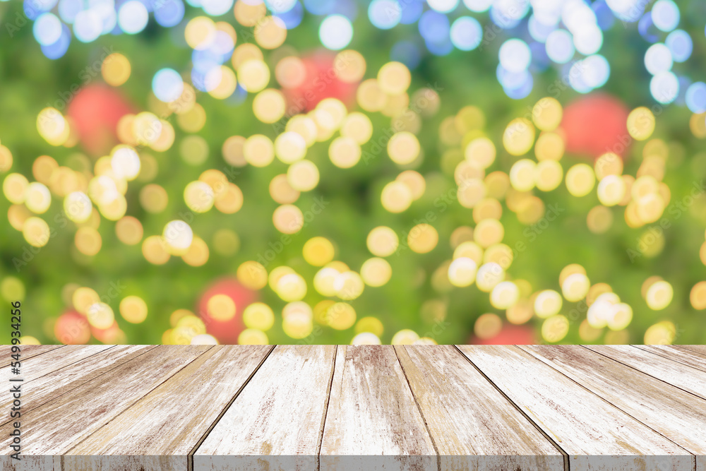 Empty wood table top with blur Christmas tree with bokeh light background Empty wood table top with blur Christmas tree with bokeh light background