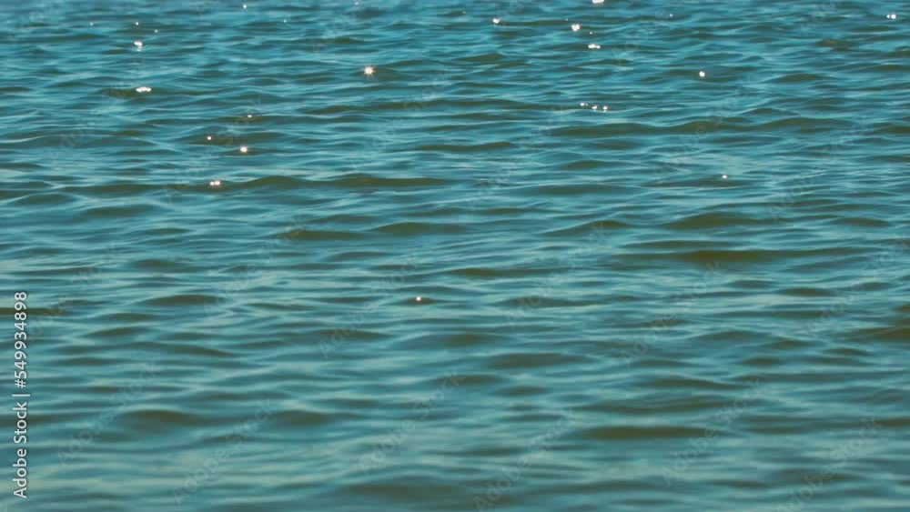 Sun shinning in the sea water waves. Bright sunny summer day. Sea water closeup Sun shinning in the sea water waves. Bright sunny summer day. Sea water closeup