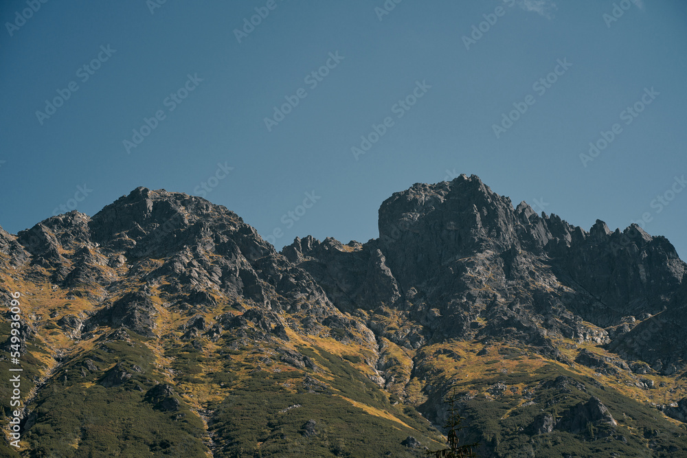 High-angle view of mountain landscape and lake at vibrant sunset. Beautiful non-urban landscape. High-angle view of mountain landscape and lake at vibrant sunset. Beautiful non-urban landscape.
